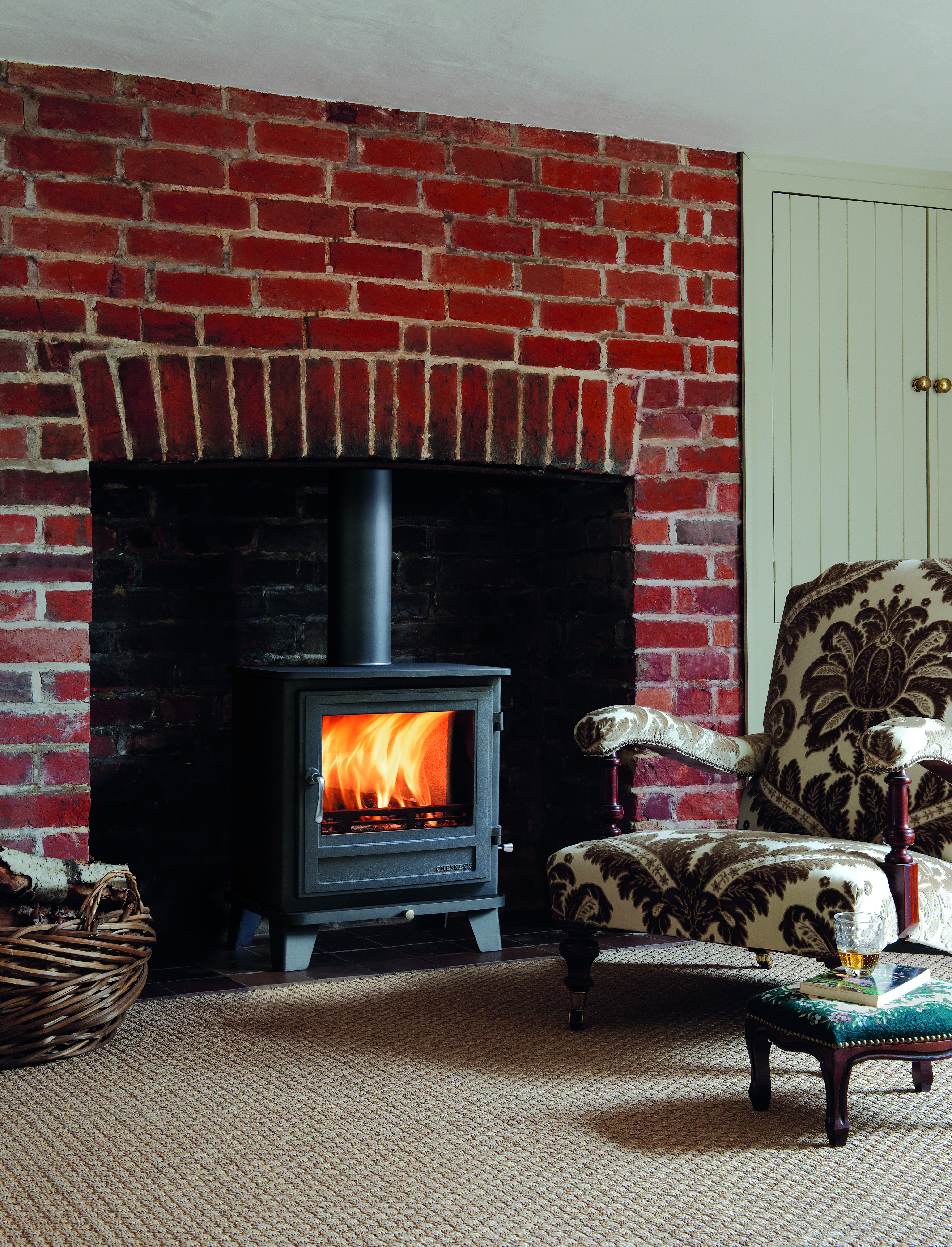 Chesneys Salisbury 8kw wood stove Multifuel option in Suffolk fireplace.